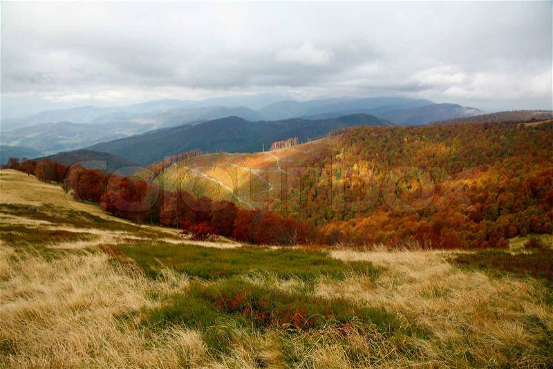 Autumn theme: an image of mountains under clouds, stock photo