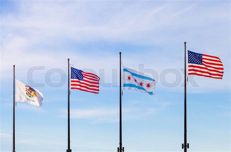 Waving flags of the state of Illinois, the United States and of the city of Chicago with sky in the background, stock photo
