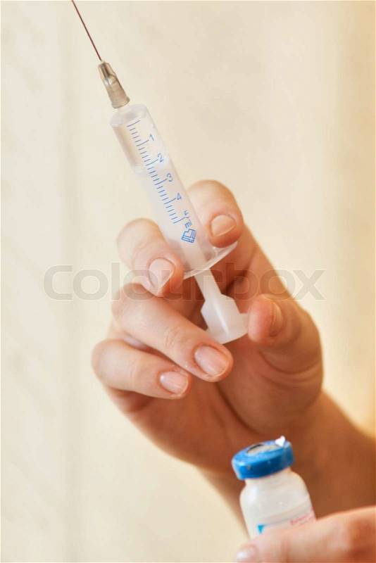 The doctor is going to do an injection, stock photo