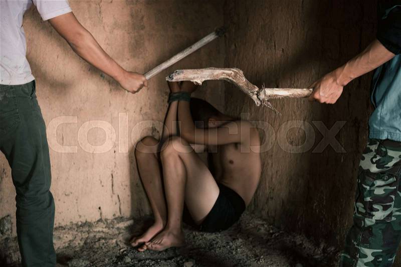 Violent criminals with children.man holding timber hit victims in abandoned building.concept for stop abusing violence.kidnapping, A fearful child, Human Rights, stock photo