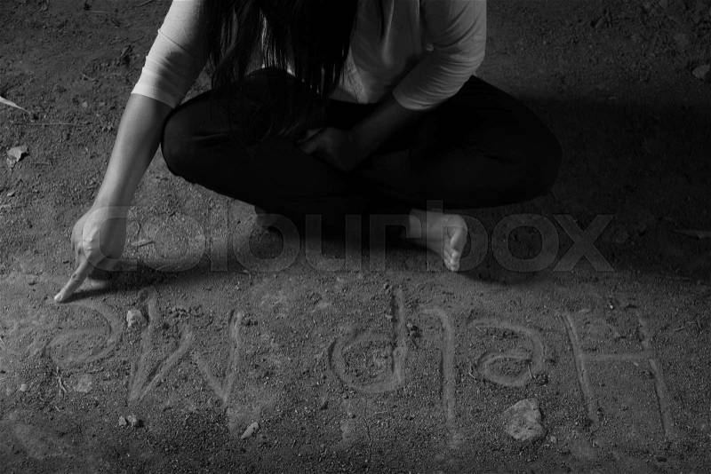 Help me sign, written with finger on grunge the floor below the women\'s hands. Violence concept, stock photo