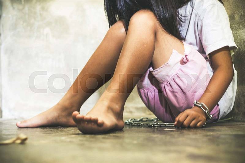 Children with chain tied, imprison, retarded, Child Abuse on black abstract concept, stock photo