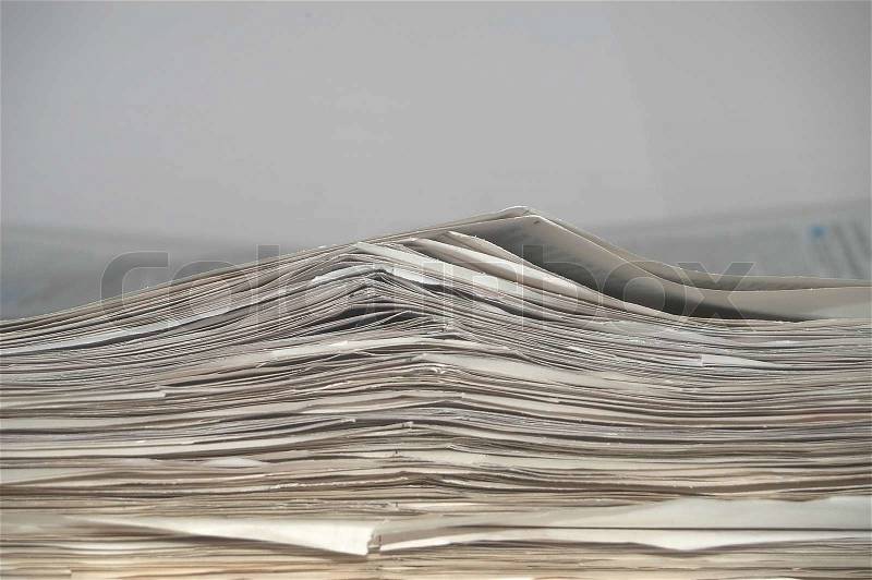 An image of a stock of old newspapers, stock photo
