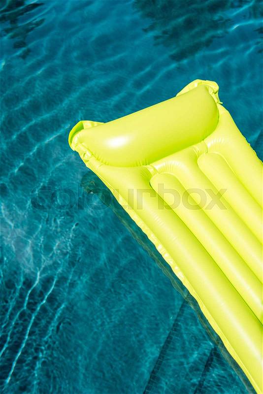 Close-up shot of inflatable mattress floating in swimming pool, stock photo