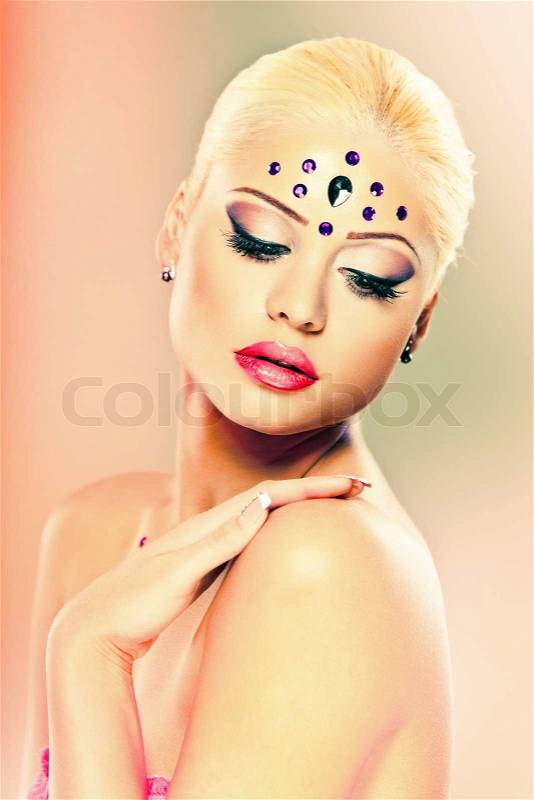 Creative makeup in pink and peach colors, stock photo