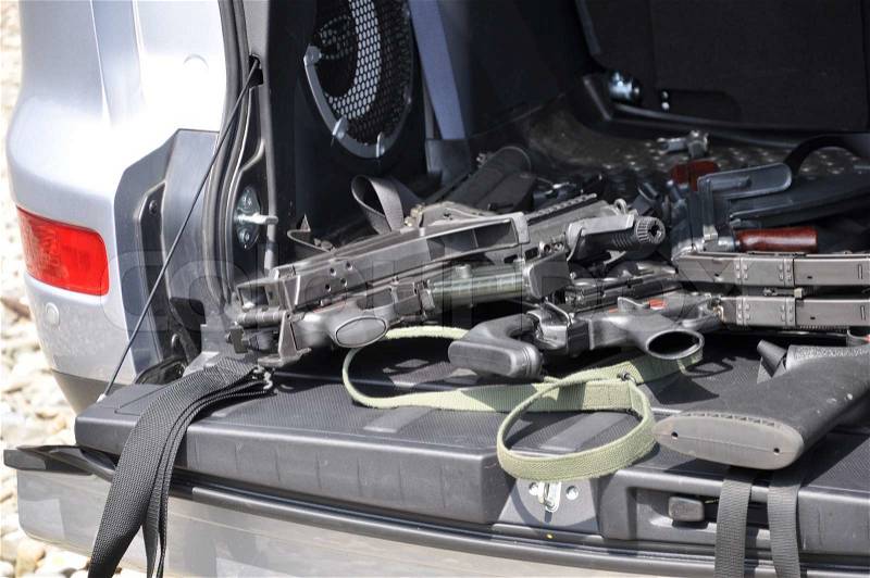 Car baggage space full of the weapons, stock photo