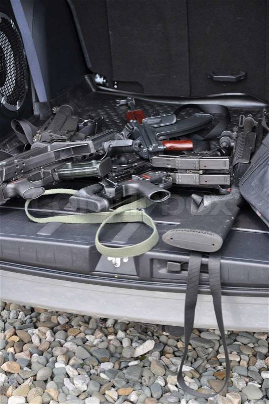 Car baggage space full of the weapons, stock photo