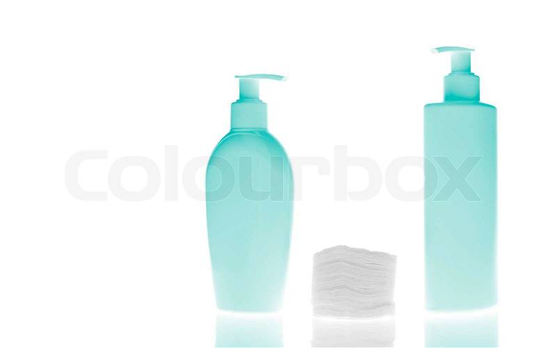 Set of cosmetic bottles with cleaning pads isolated on white background, stock photo