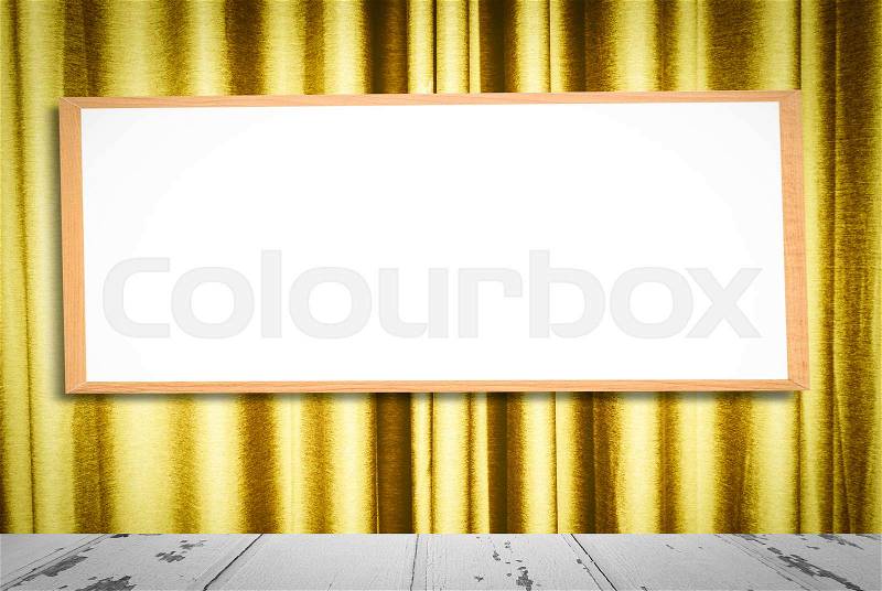 Mock up blank wooden picture frame on golden curtain background, stock photo