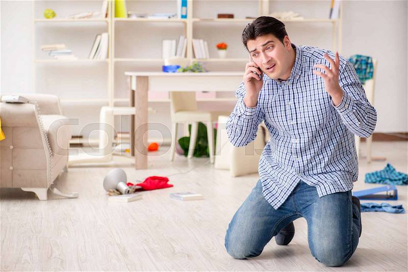 Man found his house after burglary robbed by burglars, stock photo