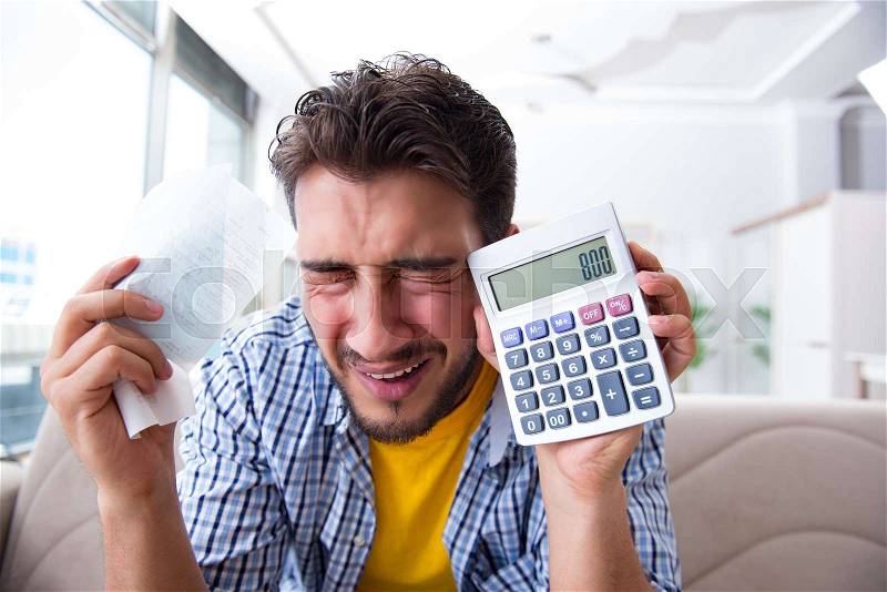 Man angry at bills he needs to pay, stock photo