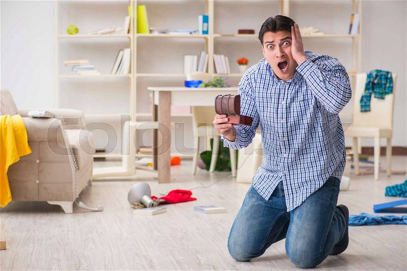 Man found his house after burglary robbed by burglars, stock photo