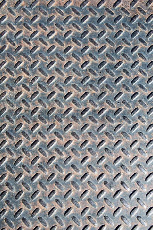 Old rusty diamond metal plate texture pattern used as abstract background, stock photo