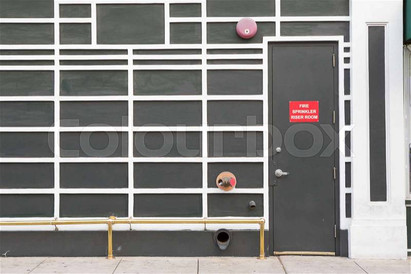 Emergency door with fire extinguisher on the wall, stock photo