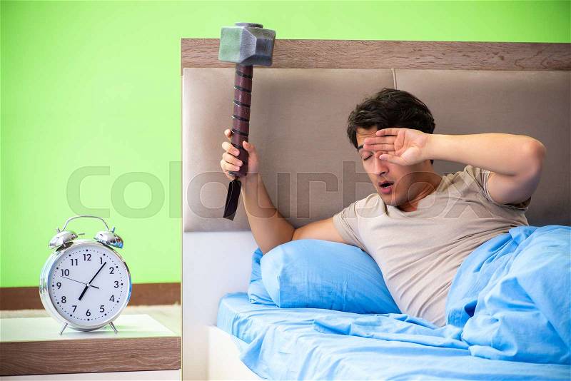 Man having trouble with his sleep, stock photo