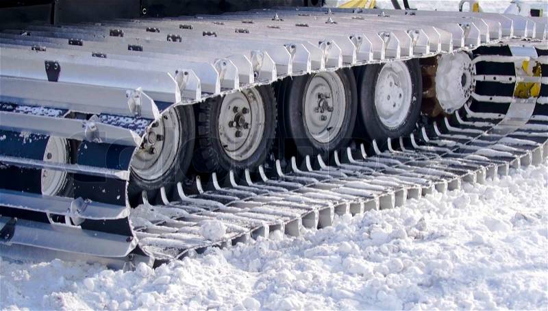 Snow-clearing equipment on a snowy background, stock photo
