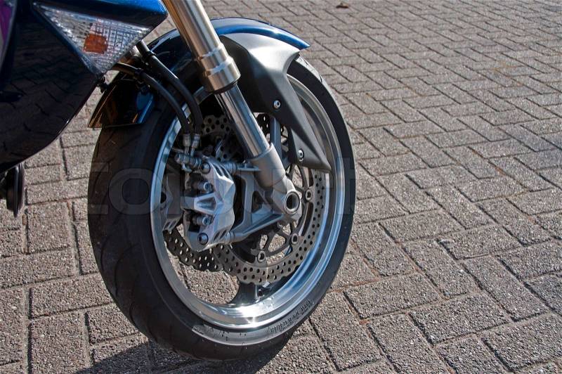 Motro wheel with tire and breaks, stock photo