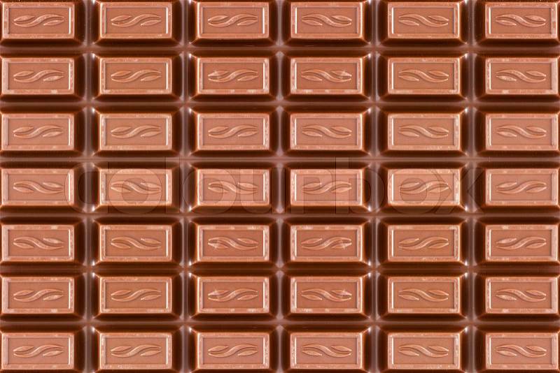 Close-up texture of dark brown chocolate bar, stock photo