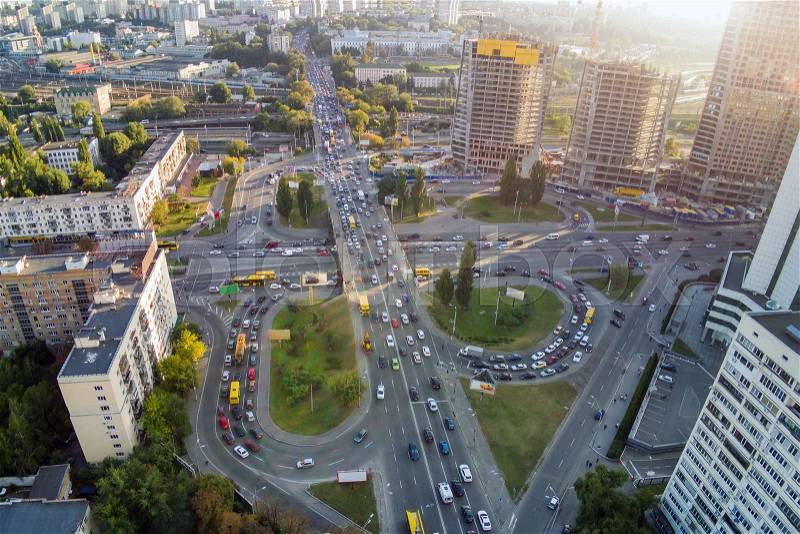 Aerial drone view of two level road junction during rush hour. Traffic jam in busy urban highway with circles. Busy street with lot of cars at Kiev, capital of ..., stock photo
