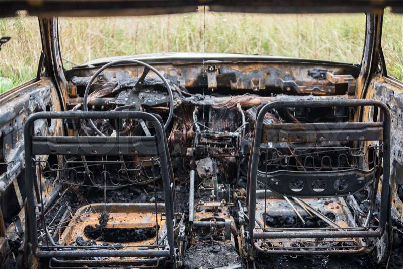 Burned out car after a car accident. Inside view, stock photo
