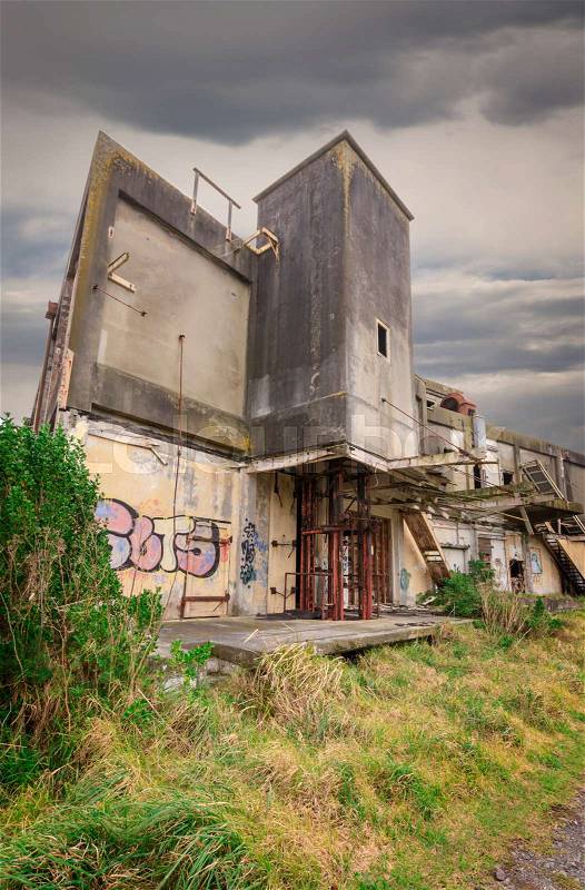 The ruins of an old factory, abandoned to the elements. , stock photo