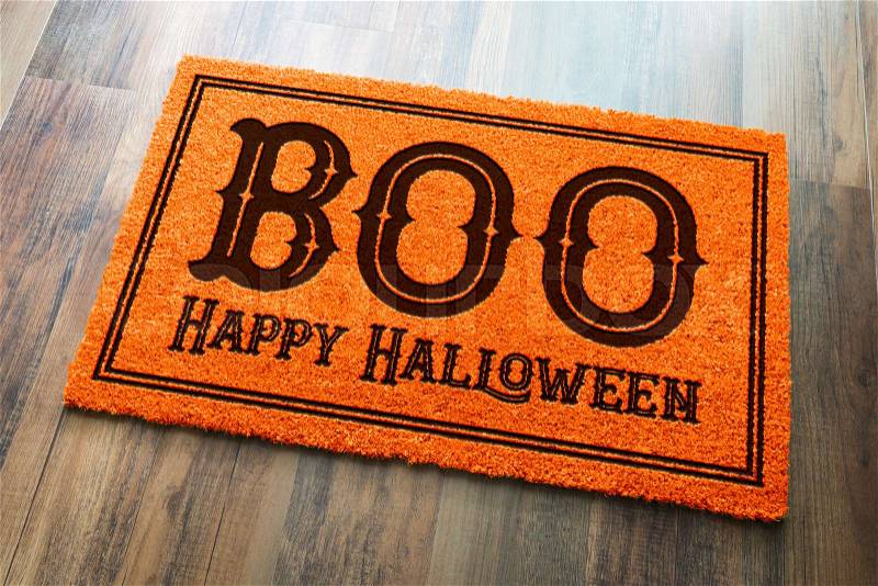 Boo, Happy Halloween Orange Welcome Mat On Wood Floor Background, stock photo