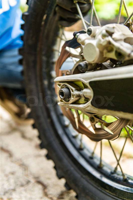 Off-road motorbike rear wheel close-up, stock photo