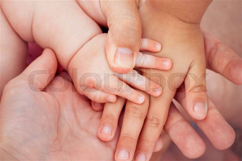 Four hands of the family. concept of love, friendship, happiness , stock photo