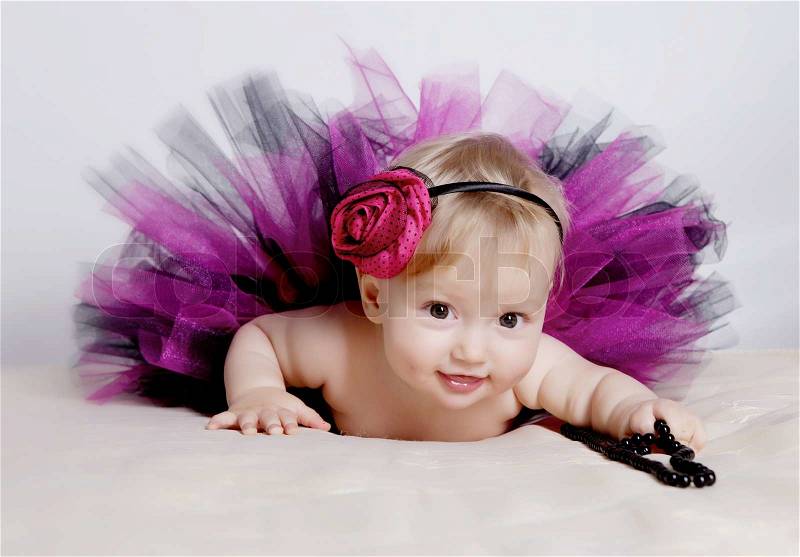 Little girl in purple dress, stock photo