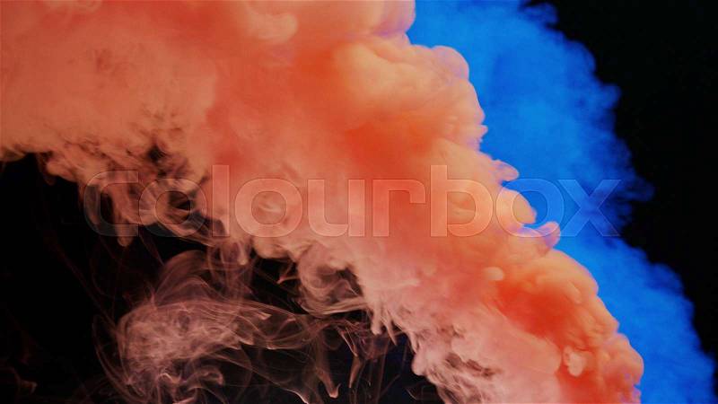 Pink and blue bomb smoke on black background, stock photo