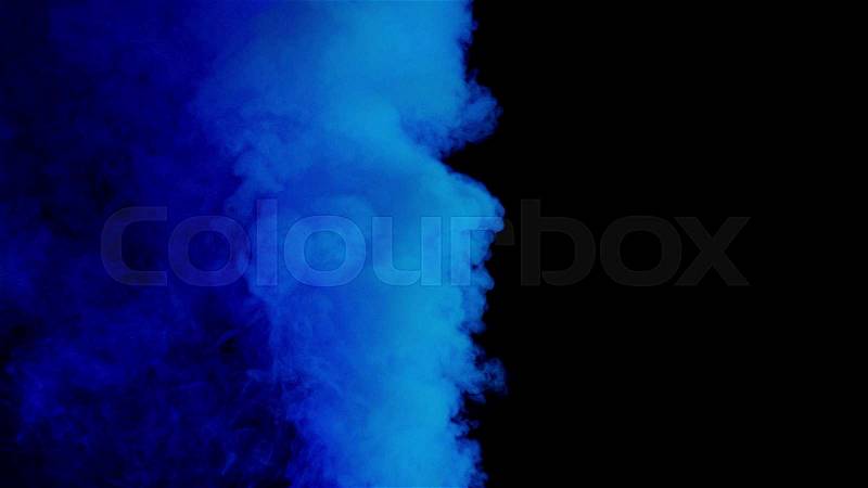 Blue bomb smoke on black background, stock photo