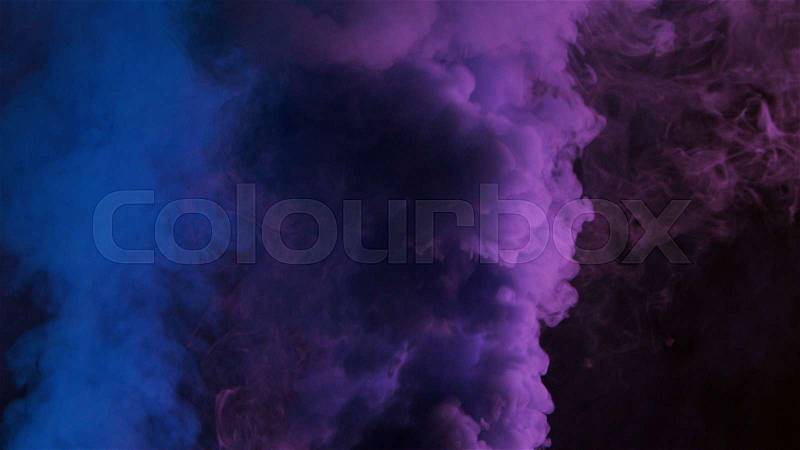 Blue and violet bomb smoke on black background, stock photo