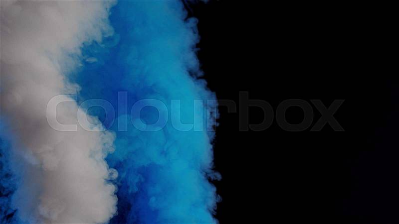 White and blue bomb smoke on black background, stock photo