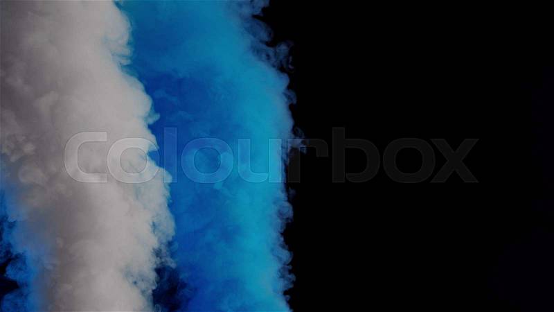 White and blue bomb smoke on black background, stock photo