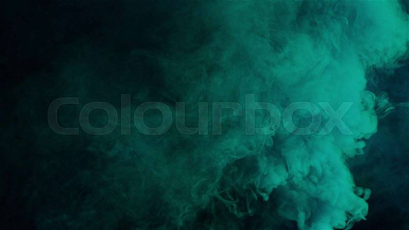 Blue and cyan bomb smoke on black background, stock photo