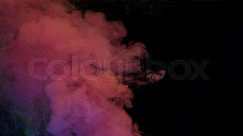 Yellow and pink bomb smoke on black background, stock photo