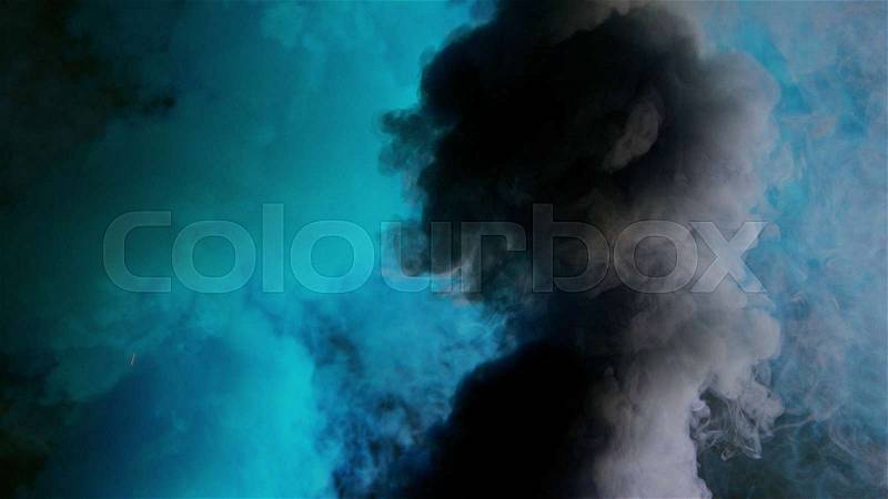 Cyan and dark bomb smoke on black background, stock photo