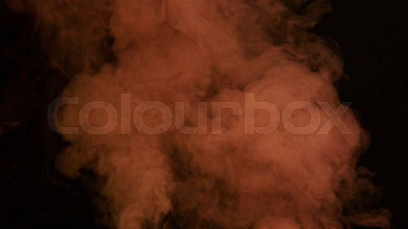 Pink bomb smoke on black background, stock photo