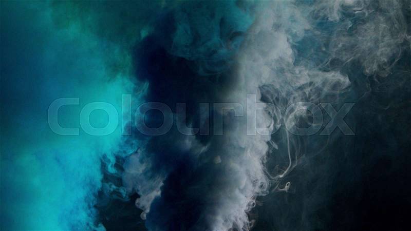 Cyan and violet bomb smoke on black background, stock photo
