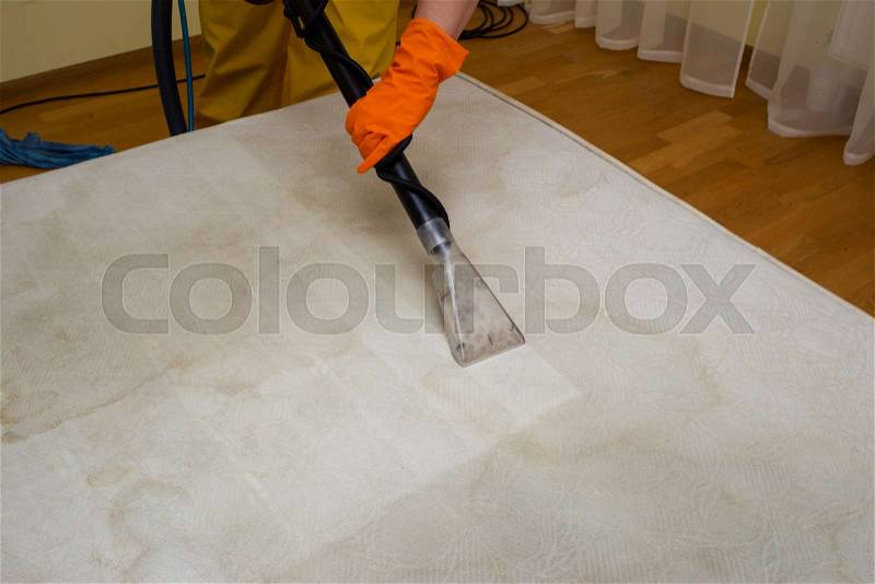 Dry cleaning of an old white mattress, stock photo