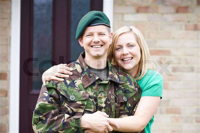 Portrait Of Soldier With Wife Home On Leave From Army, stock photo
