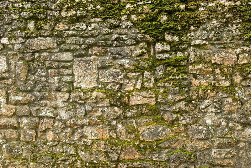 Old stone texture wall with moss, stock photo