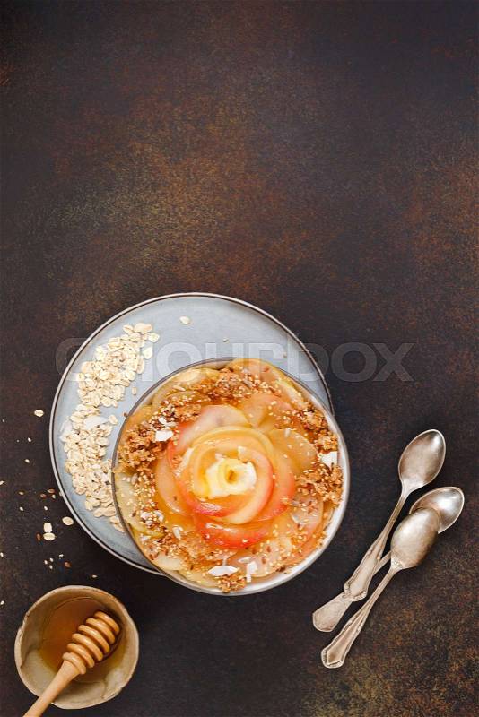 Apple pie oatmeal breakfast bowl. Clean eating cinnamon apple pie with oatmeal crust, stock photo