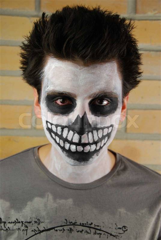 Portrait of a creepy skeleton guy Carnival face painting, stock photo