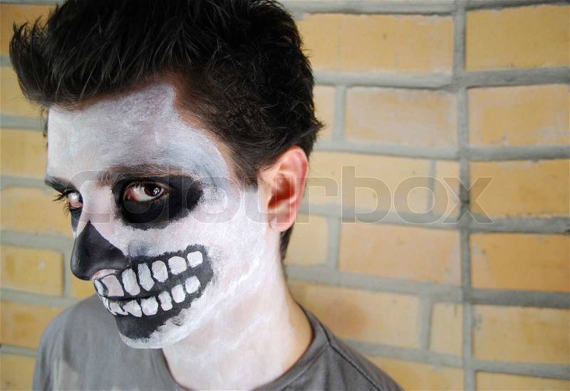 Portrait of a creepy skeleton guy Carnival face painting, stock photo