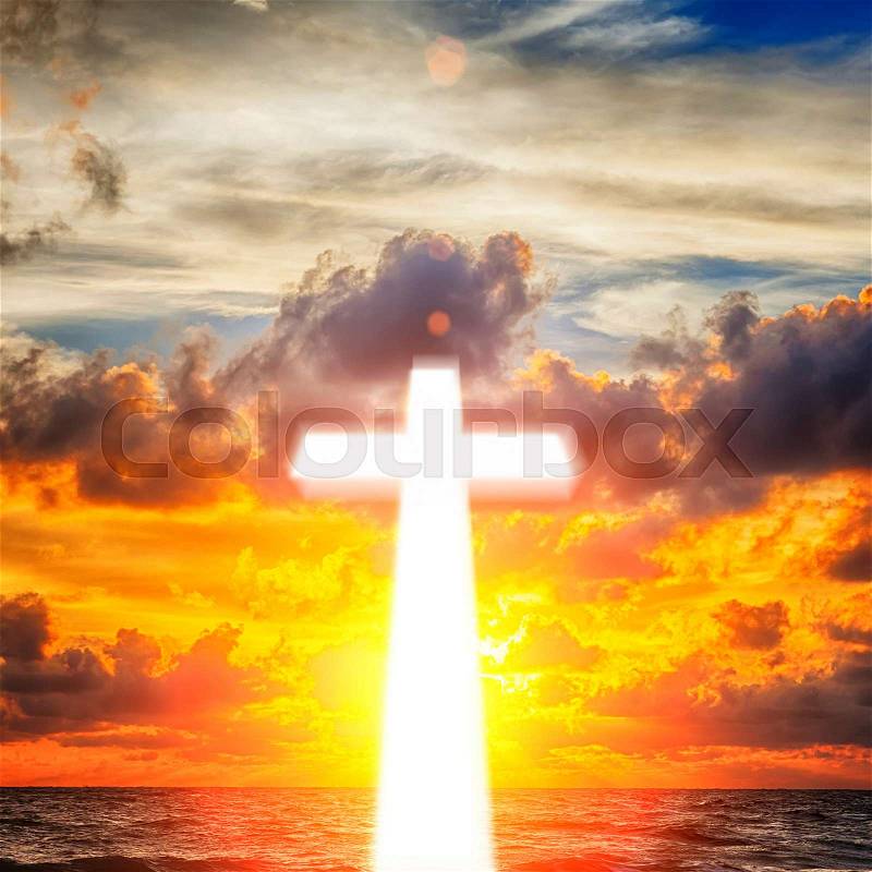 Glowing cross on beautiful sky background, stock photo