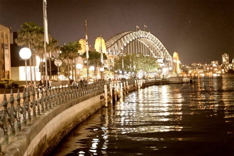 Sydney Harbor Bridge at night from Circular Quay, Australia, stock photo
