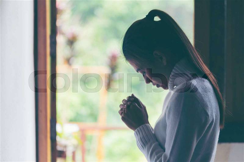 Religion, faith and people concept. Woman Pray for god blessing to wishing have a better life. begging for forgiveness and believe in goodness. Christian life crisis ..., stock photo