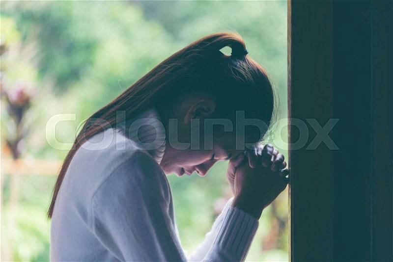 Religion, faith and people concept. Woman Pray for god blessing to wishing have a better life. begging for forgiveness and believe in goodness. Christian life crisis ..., stock photo