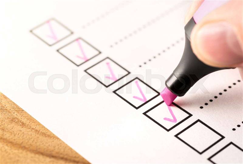 Checklist, keeping score of obligations or completed tasks in project concept. Check list document of finished work duties, progress or agenda. Business man writing ..., stock photo